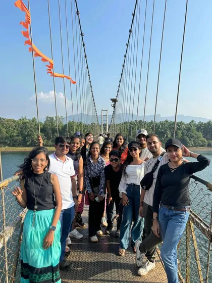 Our group on the suspension bridge, with the orange flag adding a pop of color.