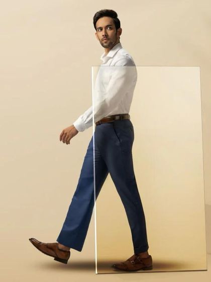 For Blackberrys Menswear, the concept was 'Upgrade Your Fit'. I styled the model in a crisp white shirt and perfectly tailored trousers to create a clean, modern, and aspirational look that emphasizes movement and fit.