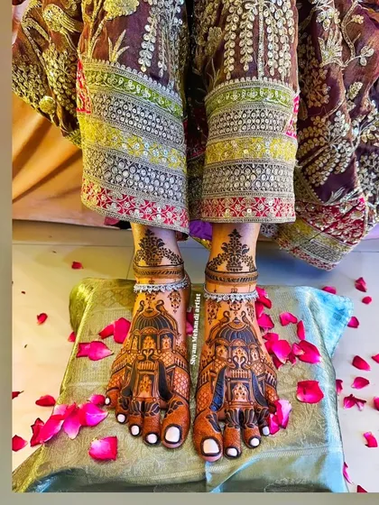 Another angle of the doli foot mehandi, showing the beautiful detail and the bride's traditional attire.