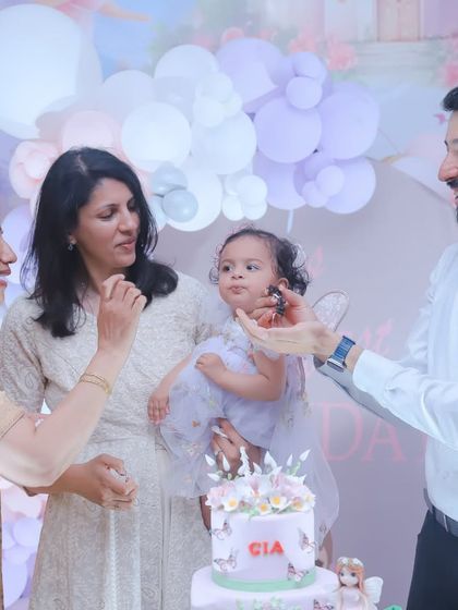 Sharing the first piece of birthday cake is a tradition to be cherished. We capture these sweet interactions between family members during the celebration.