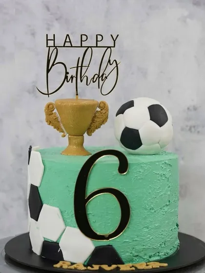 A banger of a cake for a little football champion turning six. This custom themed cake features a football, a trophy, and the birthday boy's name, making his big day even more memorable.