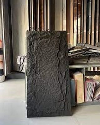A sample of our black PU stone panel. This lightweight material is easy to handle and install, giving you the look of real stone without the hassle.