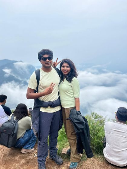 A couple enjoying the view from above the clouds. Our trips are perfect for partners, friends, and solo travelers looking to share an adventure.