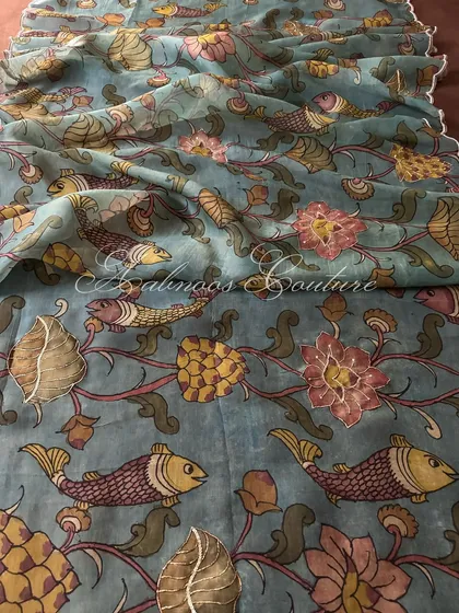 A closer look at the artistry of a pure organza Srikalahasti Kalamkari dupatta. This piece features a captivating aquatic theme, with hand-painted fish and lotus motifs brought to life with delicate, shimmering highlights.