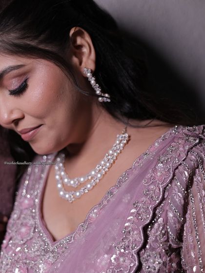 A close-up of this pastel sangeet look. The soft pink eyeshadow and pearl jewelry create a look of pure elegance.