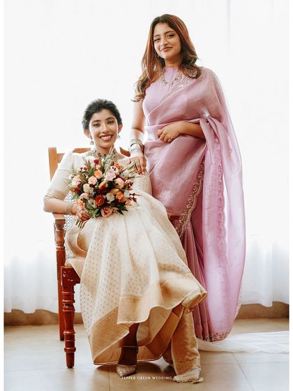 A beautiful portrait of the bride with her maid of honor, capturing a moment of friendship and support.