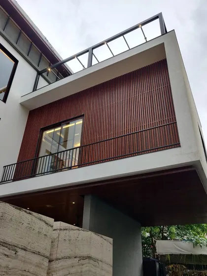 A duplicate image of a residential facade nearing completion.