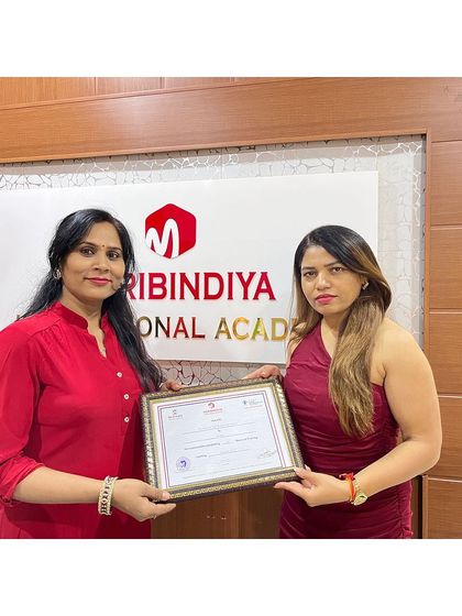 Celebrating the successful completion of her course, this graduate is ready for a career in beauty.