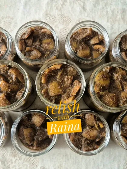 This image shows a freshly made batch of black lemon pickle. Over a few days, the lemons will absorb the dark masala and the colour will deepen significantly. This pickle is known to get better as it ages, sometimes for years.