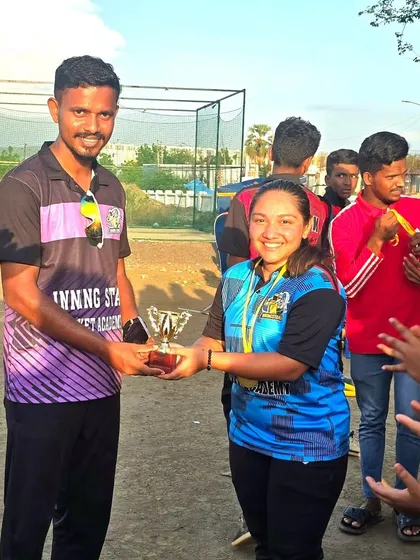 Celebrating every achievement is part of our culture. Here's one of our players being awarded 'Fighter of the Match'. We recognize not just wins, but the spirit and resilience shown on the ground.