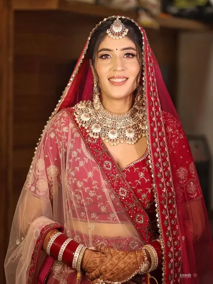 A stunning portrait from Soumya’s wedding. Her makeup is classic and radiant, perfectly suiting her traditional red lehenga.