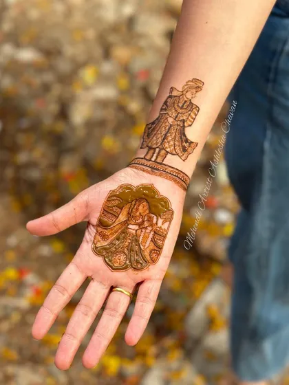 Another angle of the bride and groom portrait mehendi. The outdoor setting highlights the natural beauty of the henna.