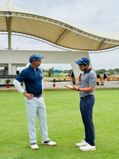 A deep conversation between me and one of my senior coaches on the practice green. Mentorship is at the heart of everything I do.