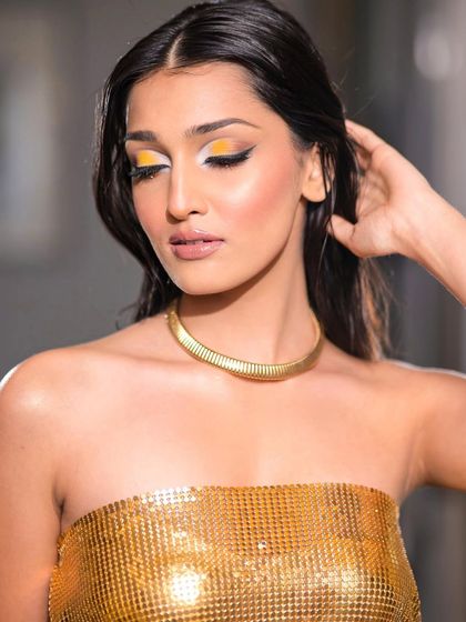 This shot captures the full essence of the "touched by gold" look. It's bold, beautiful, and perfect for a fashion-forward photoshoot.