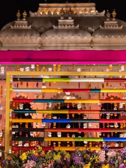 A close-up of the unique bangle backdrop used for a Mehendi ceremony. This creative detail adds a pop of color and a touch of Indian tradition to the decor.