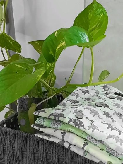 All things summery and cool. A stack of our printed shirts, including the popular elephant print, ready to be turned into comfortable outfits for little boys.