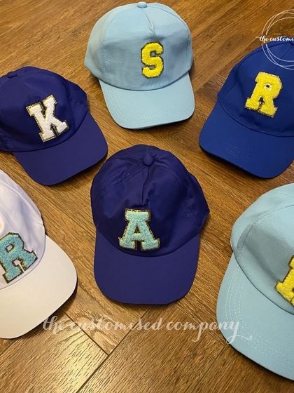 Initial thoughts: this cap is perfect. We offer a variety of baseball caps in different colors that can be personalized with chenille initial patches for a trendy, varsity-inspired look.
