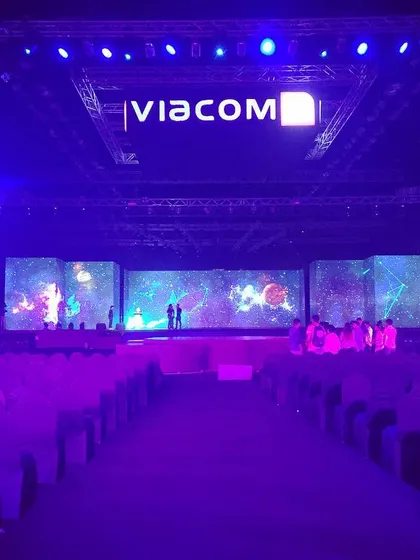 For Viacom's 10th-anniversary event, I designed this massive stage setup inside the NSCI Dome. The highlight was a 180-degree wrap-around LED screen that created a fully immersive visual experience for over 3500 attendees, showcasing my capability for large-scale corporate event production.