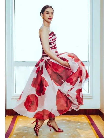A playful twirl in the Gauri and Nainika gown shows off the beautiful movement of the organza fabric and the vibrant floral print.