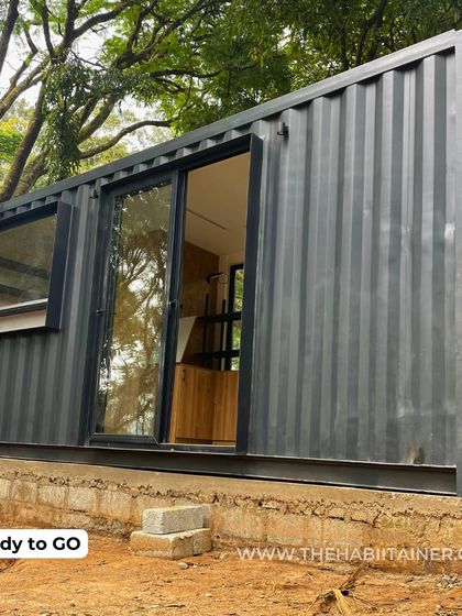 A duplicate of 98, this image shows the module immediately after placement. The structure is now ready for utility hookups and interior stocking, making it a true plug-and-play retail solution.