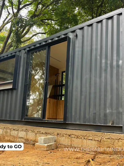 Once placed on its foundation, the container store is ready to go. The large glass sliding door and window are already installed, creating an inviting storefront.