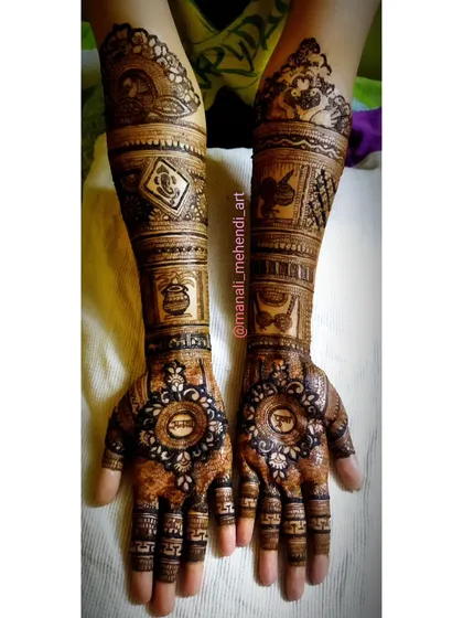 This design incorporates the couple's names, 'Shubham' and 'Pooja', into the palms. The arms feature traditional symbols like a doli (palanquin) and kalash, telling the story of the wedding.