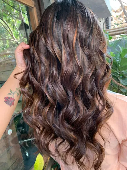 A close-up of the beautiful chocolate tones in this bridal hair. The color is rich and multi-dimensional.