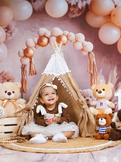 Peeking out from her little tent, this birthday girl is full of curiosity. The layered setup provides many opportunities for different types of shots.