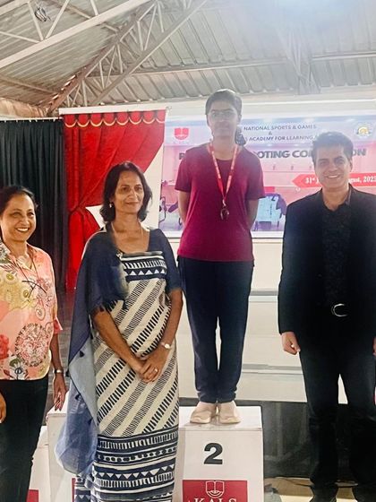 Ritisha on the podium after winning a Silver Medal in Air Pistol (Under-19) at the CISCE Regional Shooting Championship.