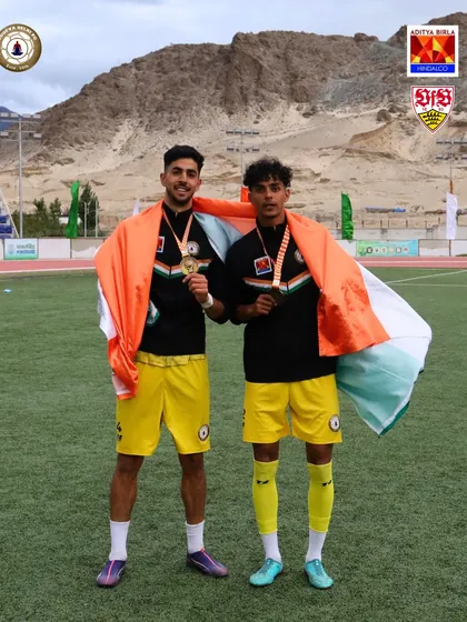 Draped in the Tiranga. Two of our champions celebrate with the Indian flag and their winner's medals after the Climate Cup final.