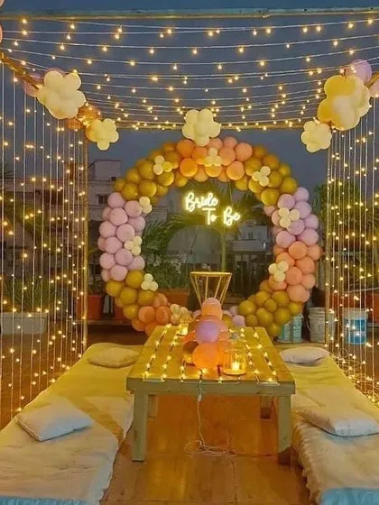Celebrations aren't just for kids. This elegant "Bride to Be" terrace party setup shows how we transform any space into a magical venue. We used a canopy of fairy lights and a custom balloon ring to create a dreamy, intimate atmosphere perfect for a special night.