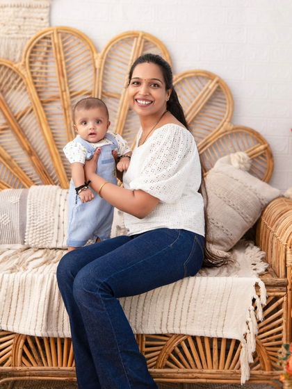 A mother and her baby in a beautiful, light-filled setting. The boho decor adds a soft, natural element to this sweet portrait.