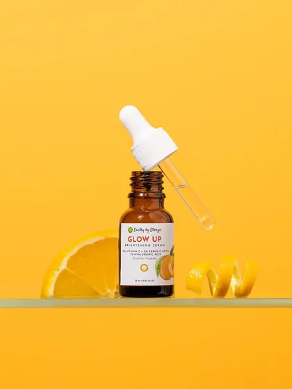 A burst of sunshine for a brightening serum. We used a vibrant, monochromatic yellow setup with fresh orange slices and peels to create an energetic and joyful image that instantly communicates the product's Vitamin C benefits.