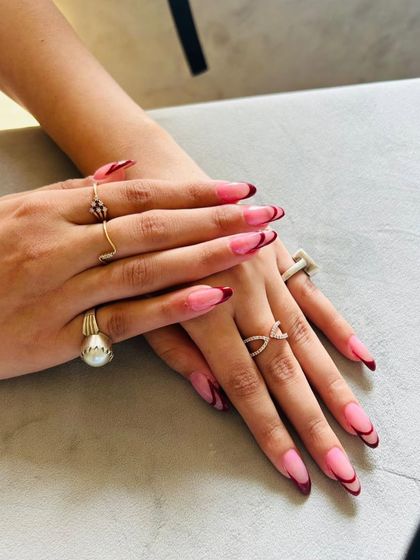 This "expensive" French look is all about clean lines and rich color, shown here on beautifully shaped almond nails.
