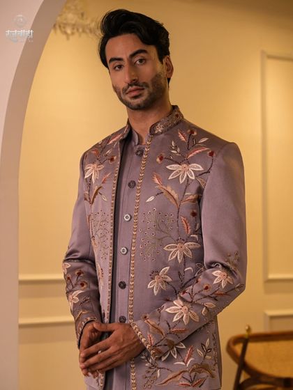 This angle showcases the craftsmanship on the sleeve and front panel of the mauve Jodhpuri. It's a perfect blend of traditional motifs and a modern color palette.