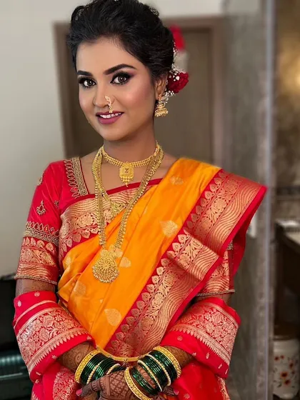 The complete Maharashtrian bridal look, with the traditional green glass bangles and nath (nose ring).