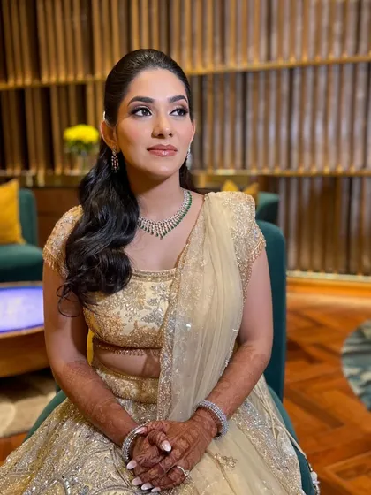 A three-quarter view of Supriya's Sangeet look. The makeup is expertly blended to look seamless and natural, even under event lighting.