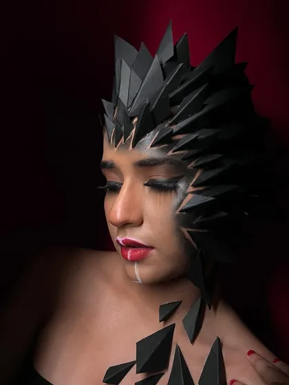 A demure pose that adds a different mood to this powerful fantasy look.
