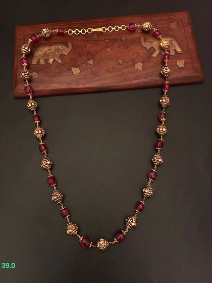 A rich maroon beaded necklace from my 92.5 silver gold-plated collection. The color is deep and luxurious, perfect for festive occasions.