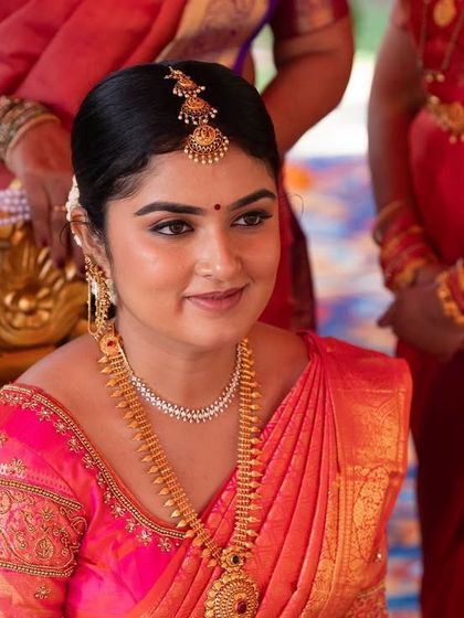 A close-up of the bride's happy face during her wedding. I focus on creating a radiant base that glows from within, making her look and feel her best.