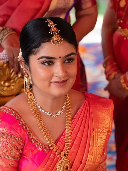 A close-up of the bride's happy face during her wedding. I focus on creating a radiant base that glows from within, making her look and feel her best.