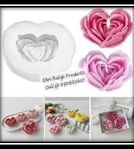 This heart-shaped rose mold is perfect for creating romantic candles or soaps. The image shows the mold and several finished examples, highlighting its versatility.