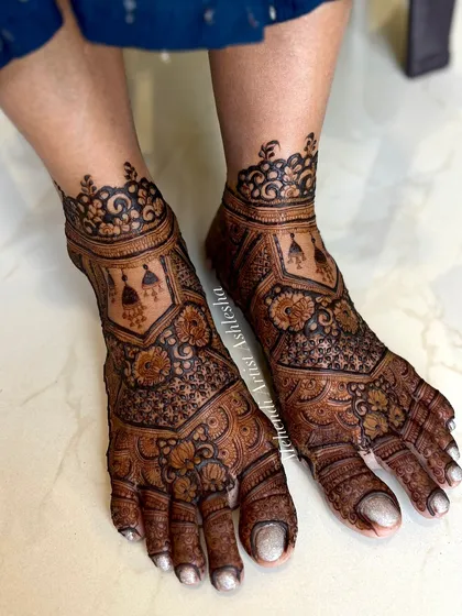 A full-coverage bridal feet design with intricate patterns. The design is dense and beautiful, perfect for a bride who wants a traditional look.