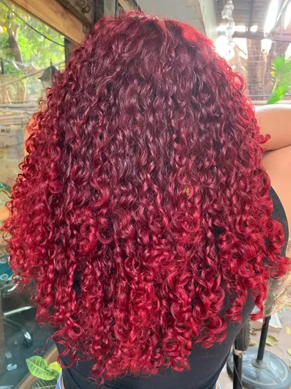The back of the fiery red curls, a testament to how vibrant a non-bleach color can be.