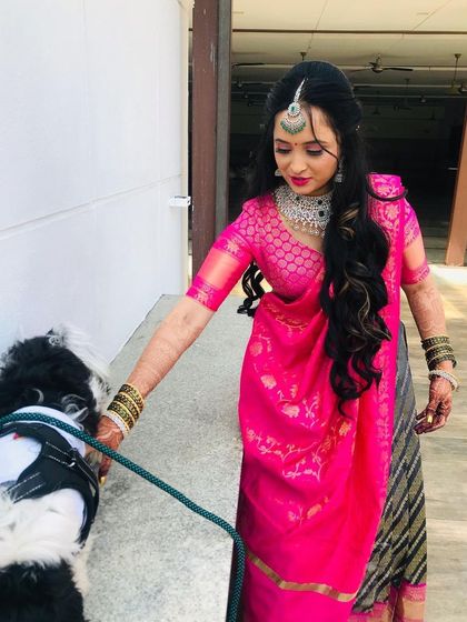For her welcome ceremony, my bride chose a beautiful pink and grey half-saree. The makeup is fresh and bright, with soft curls and sparkling jewelry.