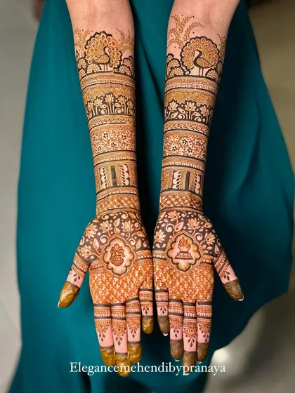 A classic full bridal mehendi design that is both grand and elegant. The symmetrical patterns feature my signature peacocks, delicate lotuses, and intricate jaal work for a timeless look.
