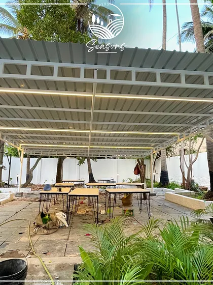The outdoor seating area at Roy's Cafe under construction. This "before" shot shows the potential of the space, which we are transforming into a vibrant garden.
