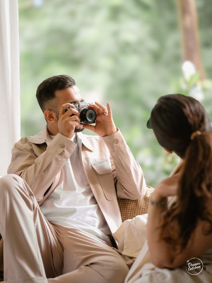 A playful moment where the groom takes a photo of the bride. We love incorporating personal elements and hobbies into our shoots to make them feel more authentic and representative of the couple.