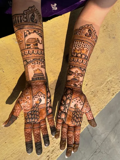 The same bridal design, captured in the sunlight. The natural light brings out the rich, warm tones of the henna stain.