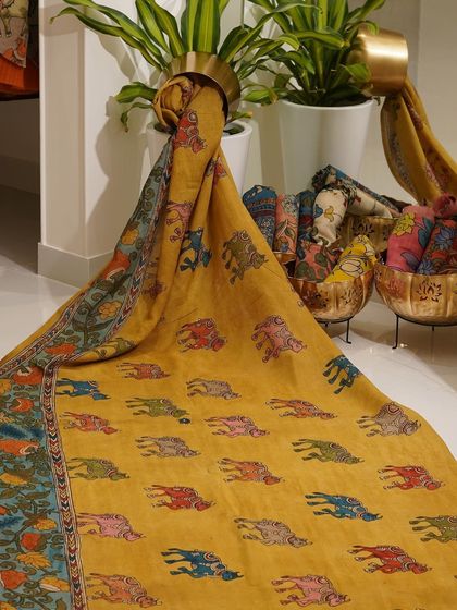 This is a glimpse into my Kalamkari Edition, featuring a wide array of hand-painted dupattas and fabrics from the Indralokam series. Each piece is a unique story, available for you to customize into your dream outfit.